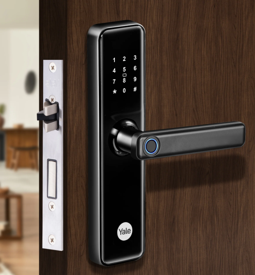 Yale smart fingerprint door lock with keypad on wooden door